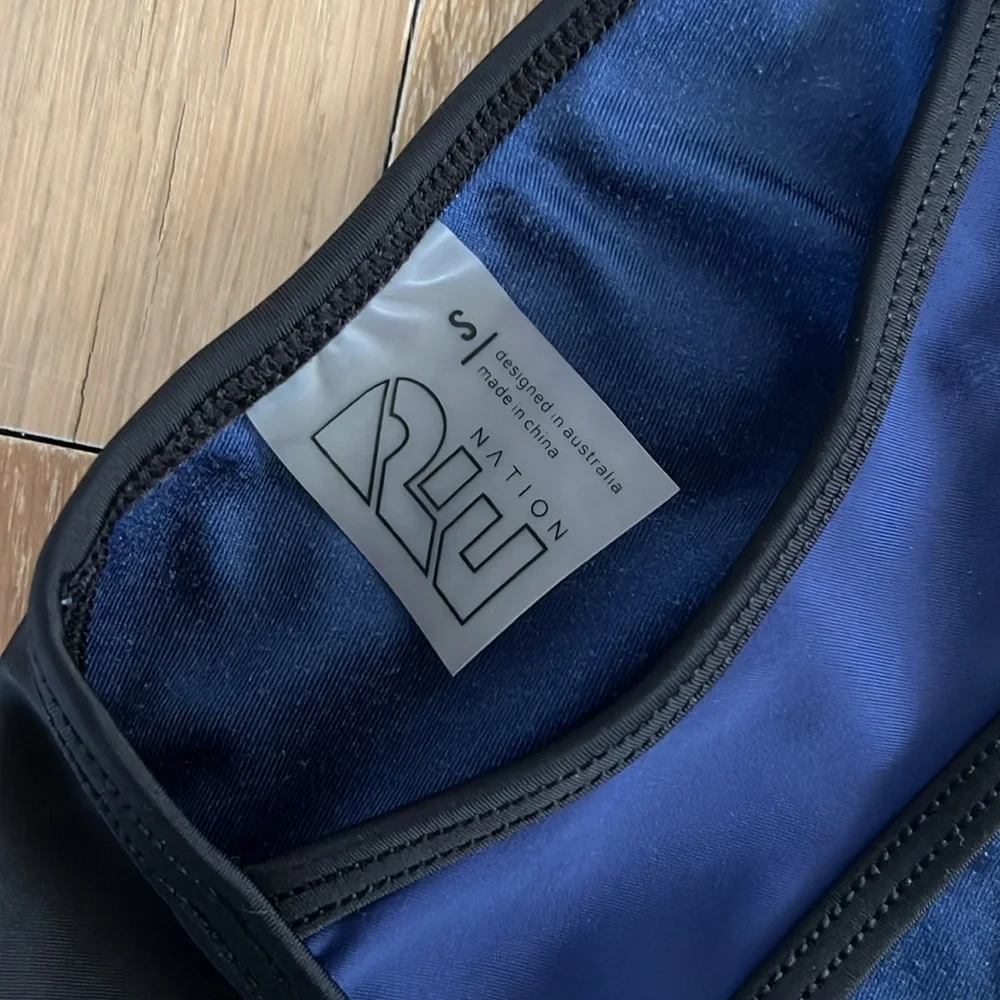 P.E Nation Navy Blue and Black Sports Bra with Red Logo